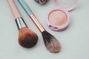 Make up and brushes, selecting cleaner personal care products.