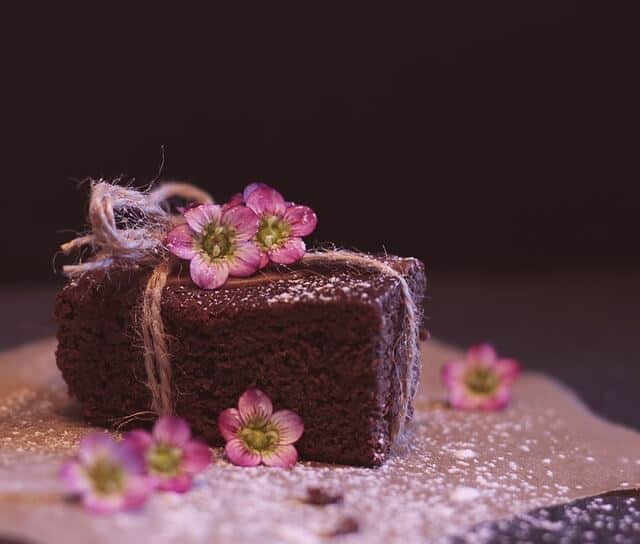 Chocolate cake decorated with twine and flowers. My favorite chocolate vinegar cake recipe.