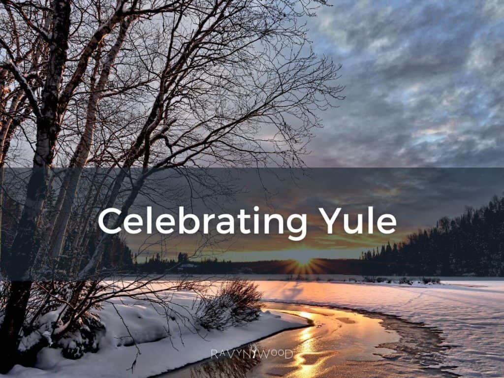 Celebrating Yule image is a snowy waterway at sunset with a bare tree on left.