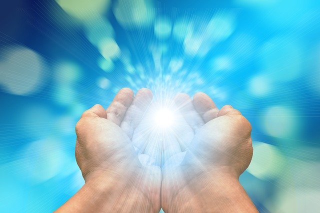 Reiki Distance Sessions, hands with light beaming from them.