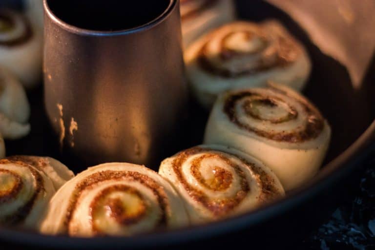 cinnamon rolls recipe from fresh baked bread dough, shown in a baking pan