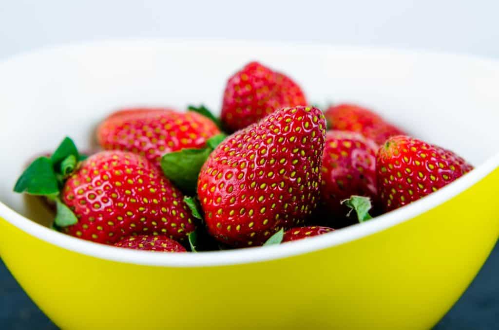 Strawberries in a yellow bowl, strawberry shortcake recipe