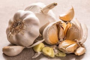 Using garlic with your food is a natural way to boost your immune system. Cloves of garlic.