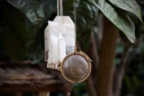 mesh tea ball shown with paper tea bags for making herbal water infusions