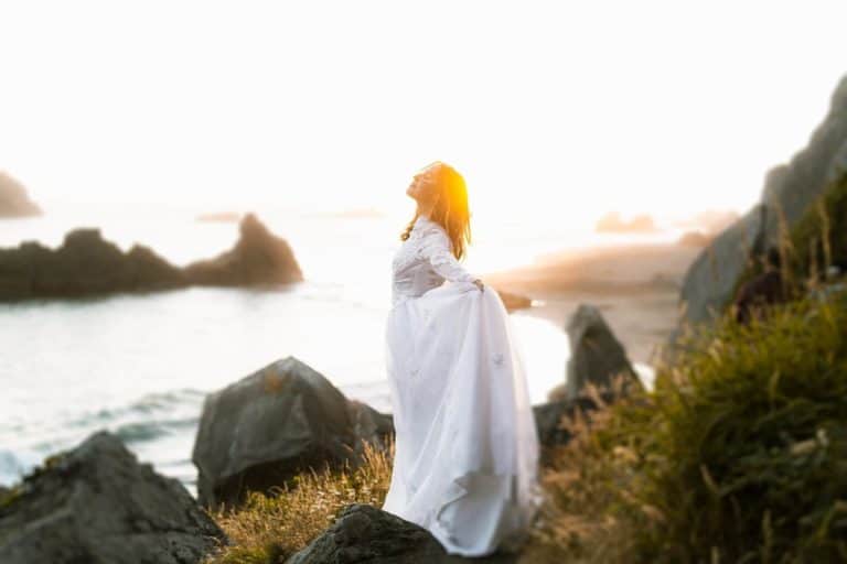 woman enjoying a moment of calm beside the water as a way to practice mindfulness anywhere.