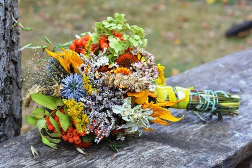 The Spirit of June: Nature's Lessons for Personal Growth 4 summer bouquet of mixed cut flowers on a weathered board depicting the spirit of June