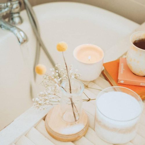 Ravynwood Foundations - self care - image shows a bathtub and a bouquet, candle, cup of tea sitting beside it.